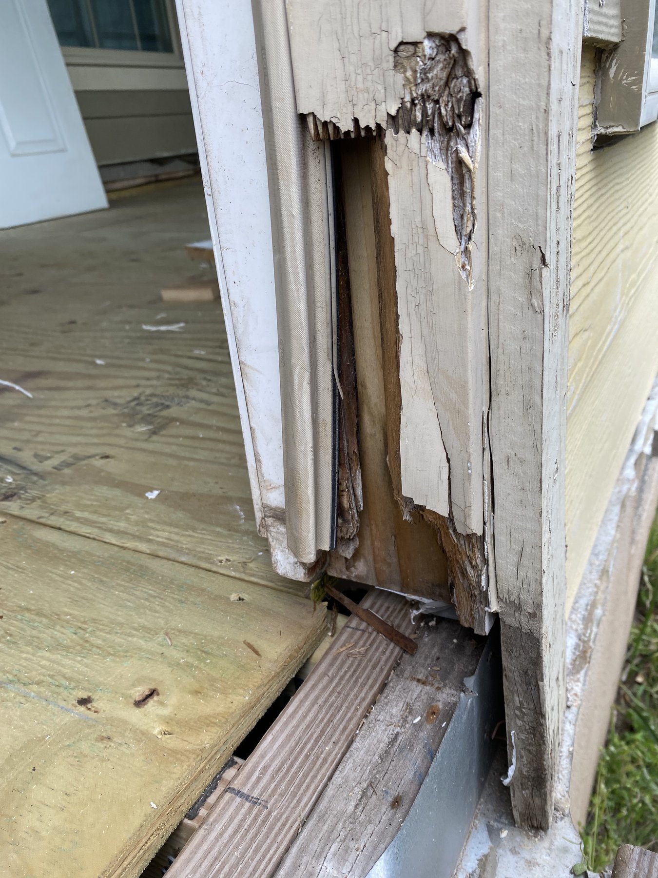 Damaged front entry trim before repair