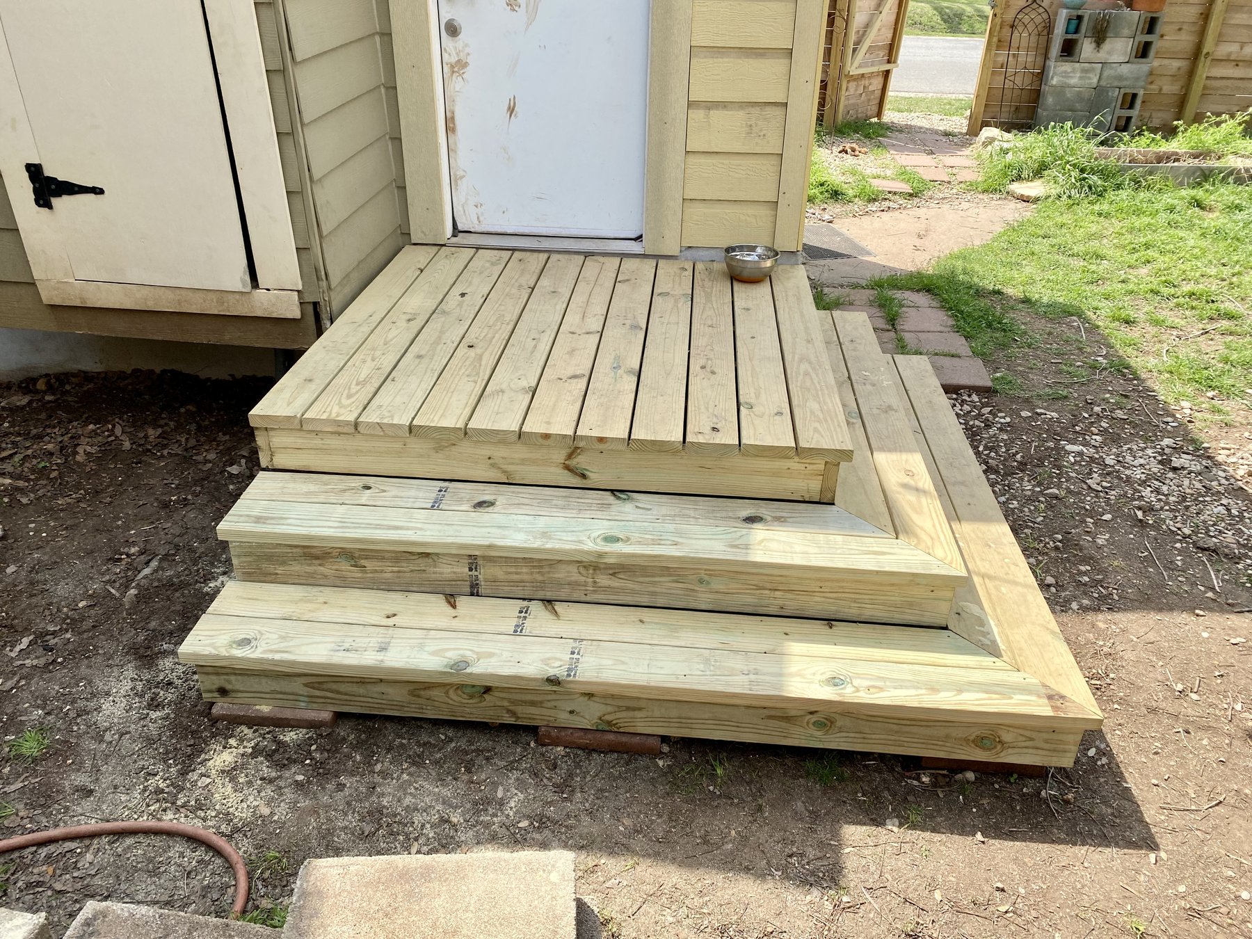 Finished rear entry platform and wraparound steps