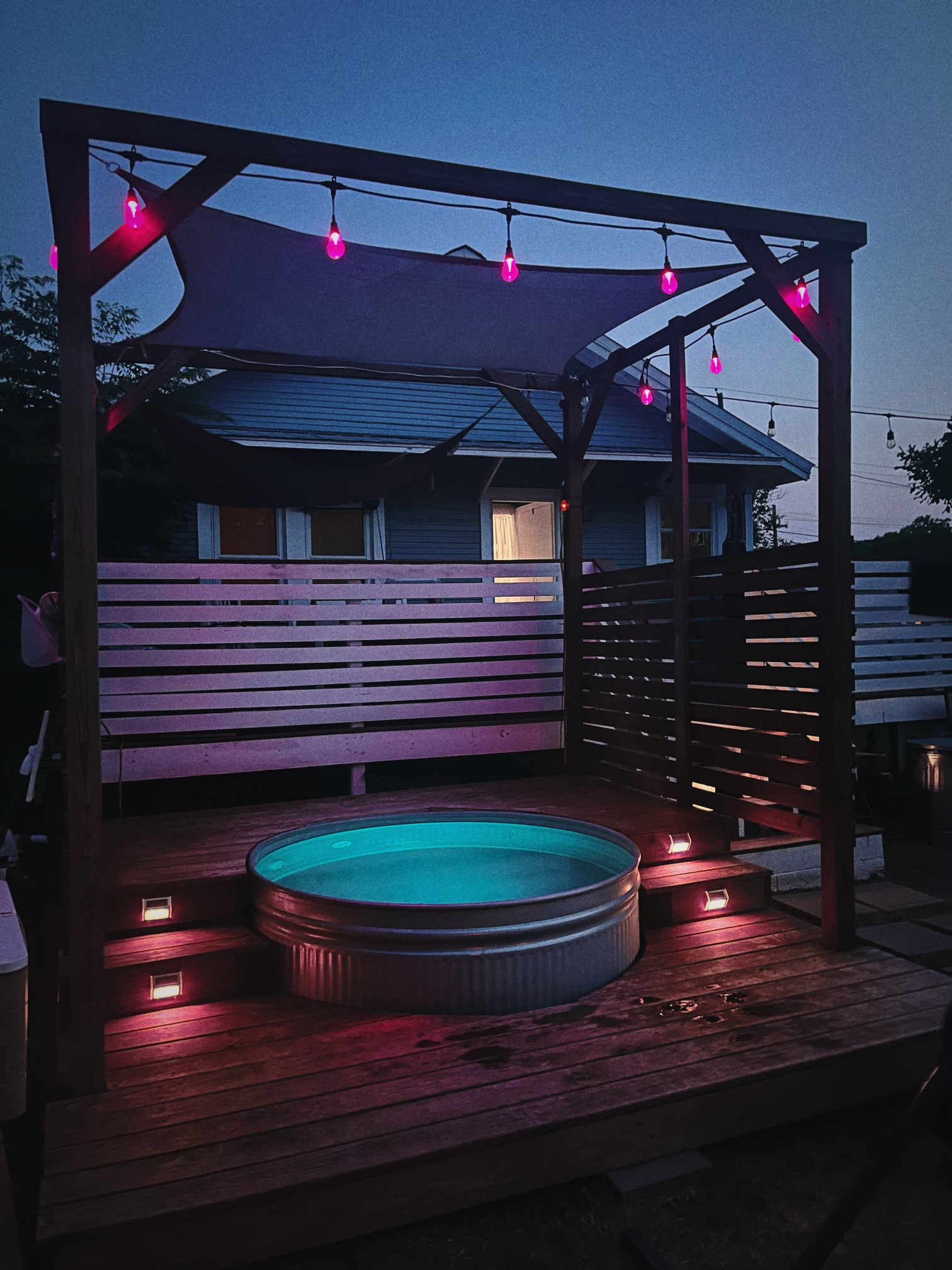 Complete cowboy pool deck and pergola at night