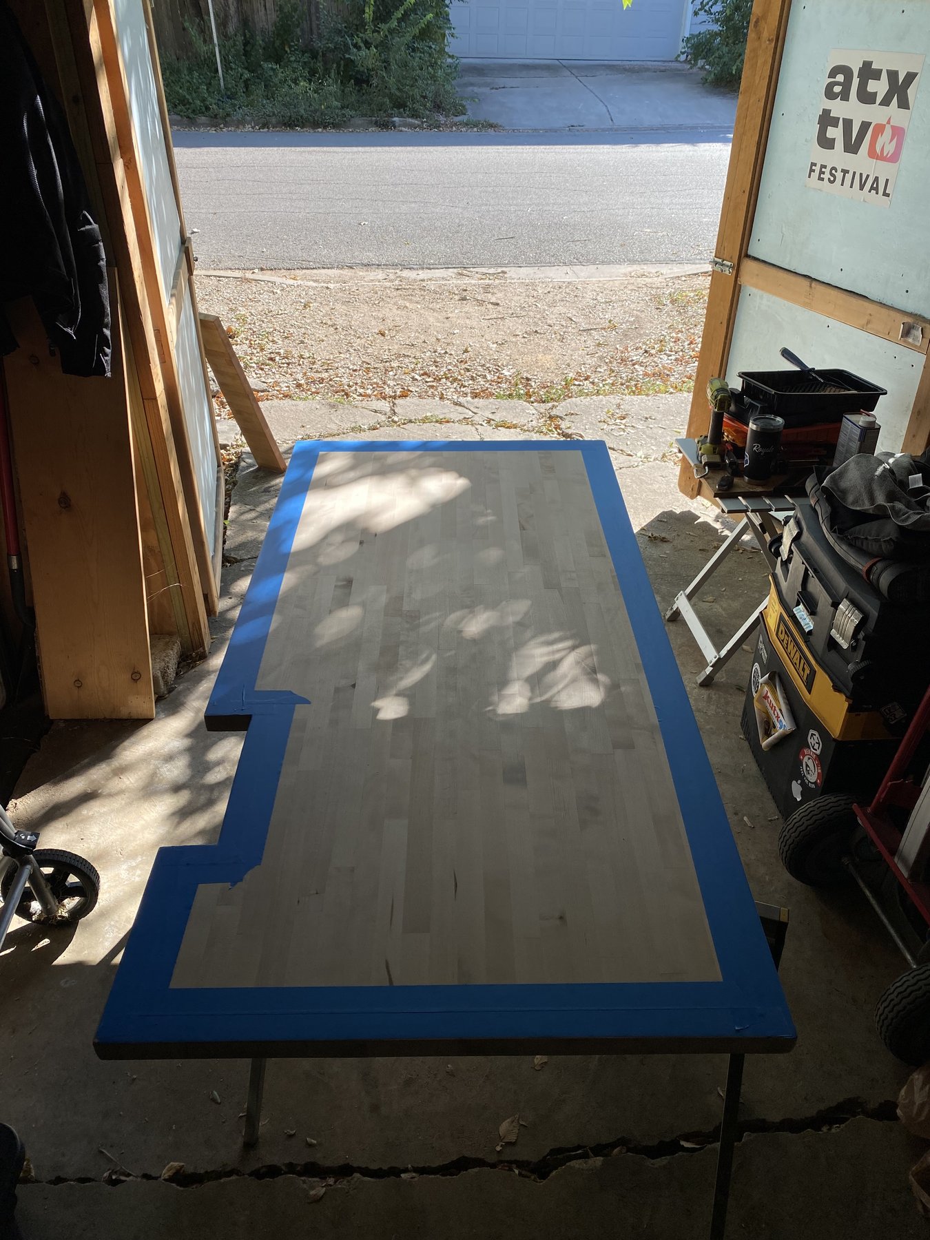 Butcher-block laundry counter being laid out and finished in the shop