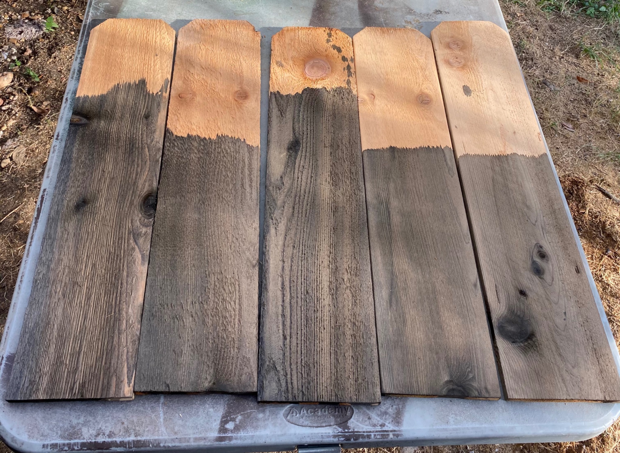 Multiple new lumber boards during the vinegar-aging treatment
