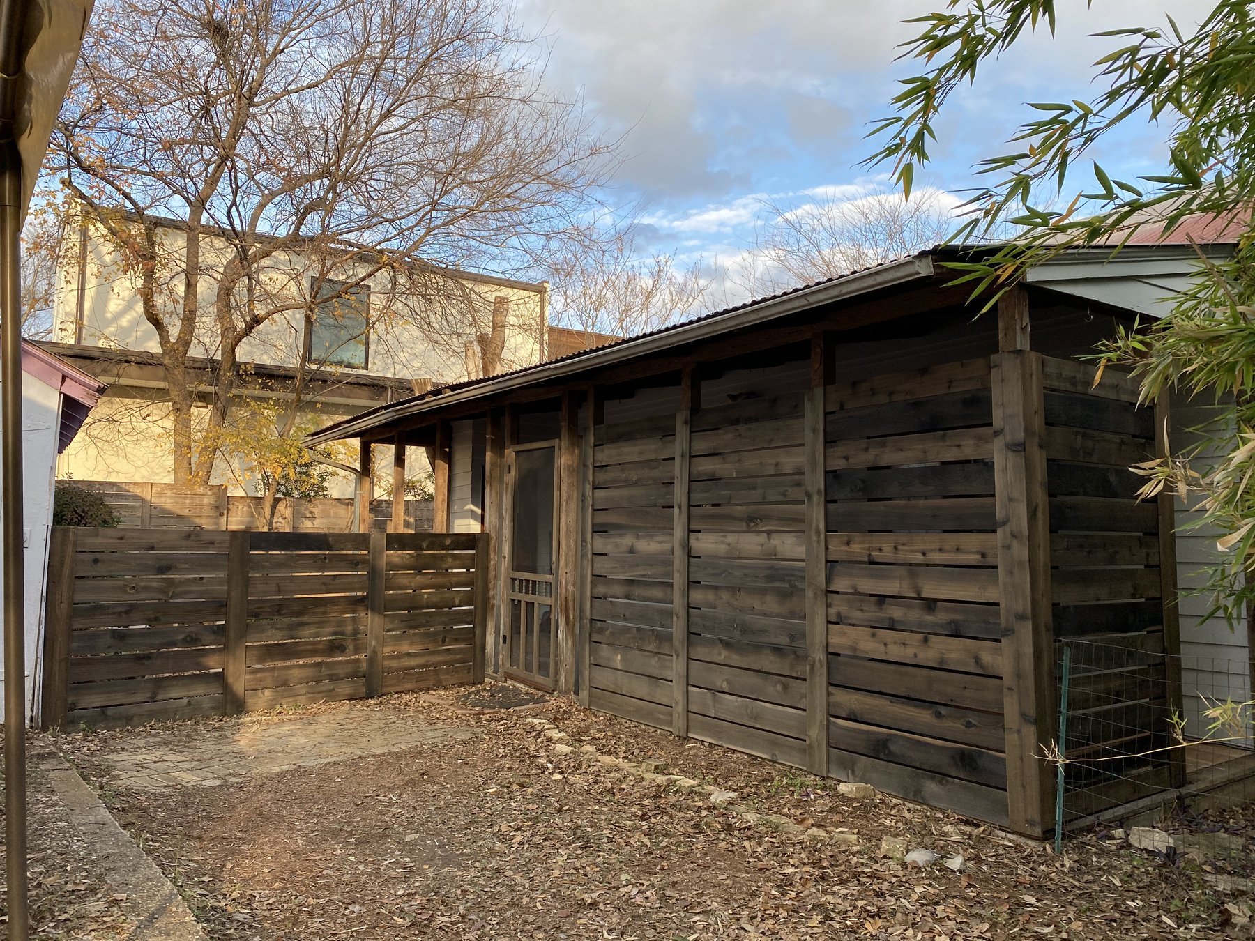 Finished vinegar-aged privacy enclosure and rebuilt adjoining fence