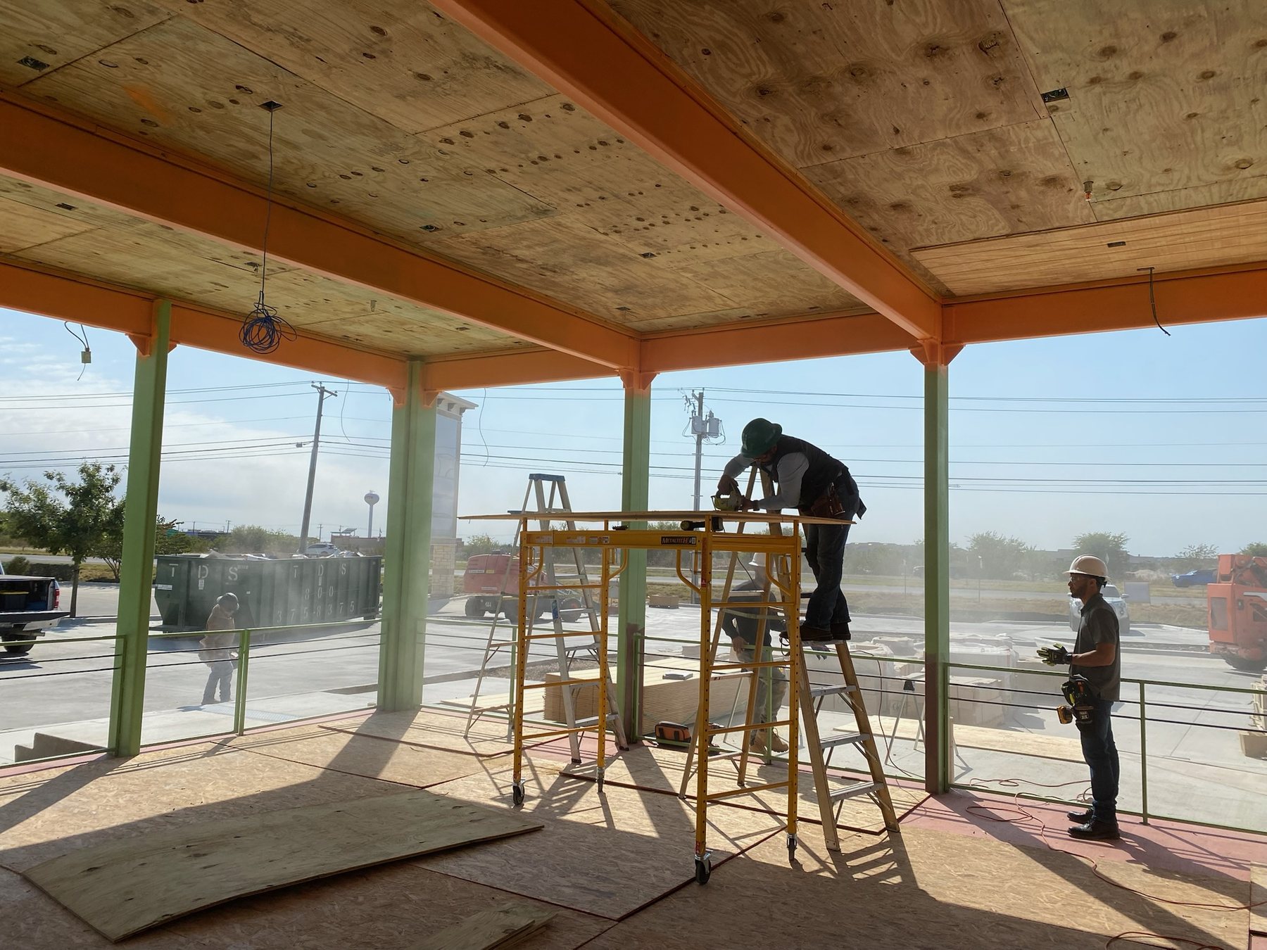 Wood patio ceiling installation at Chuy's
