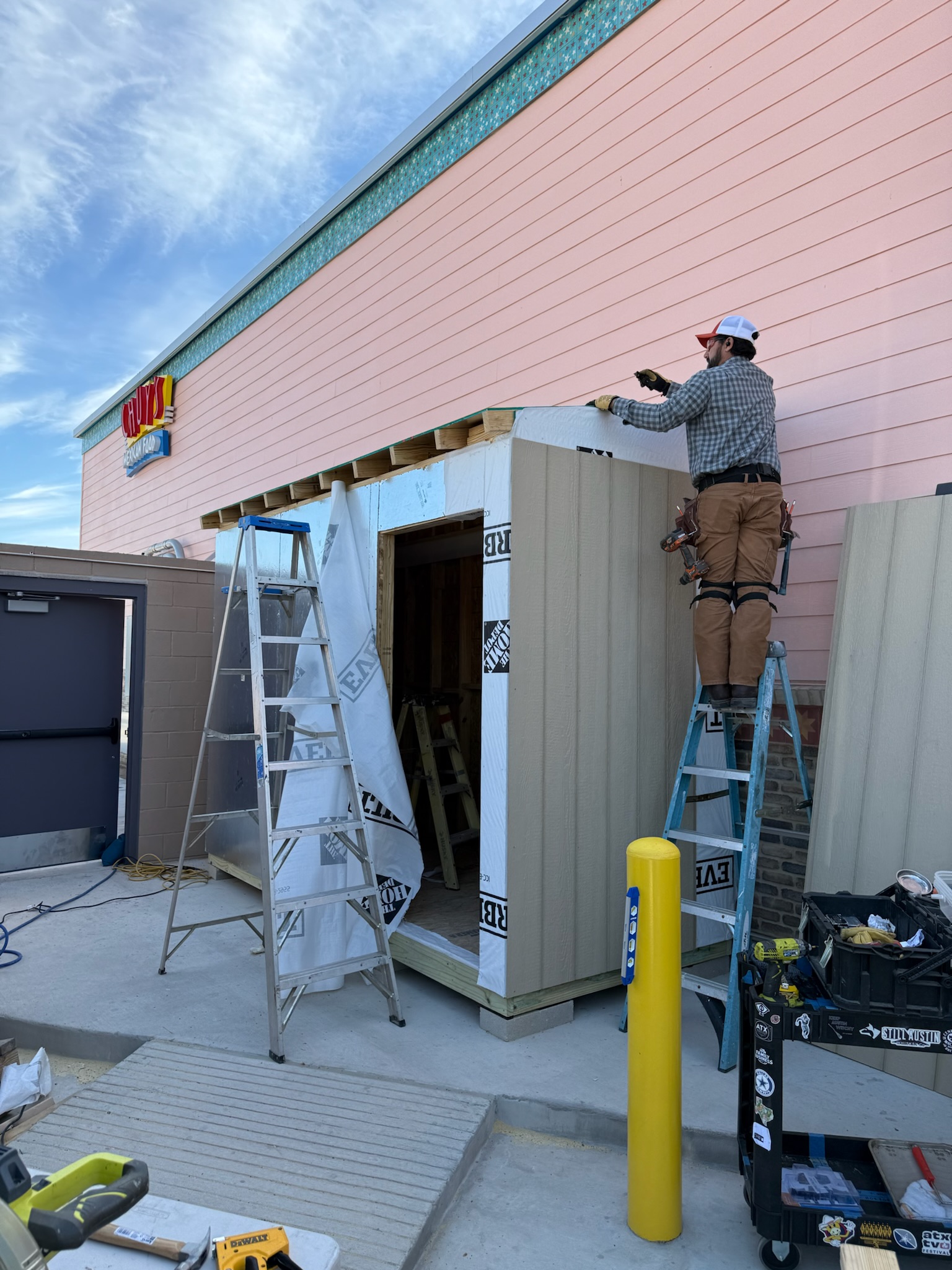Custom Chuy's storage shed during exterior construction