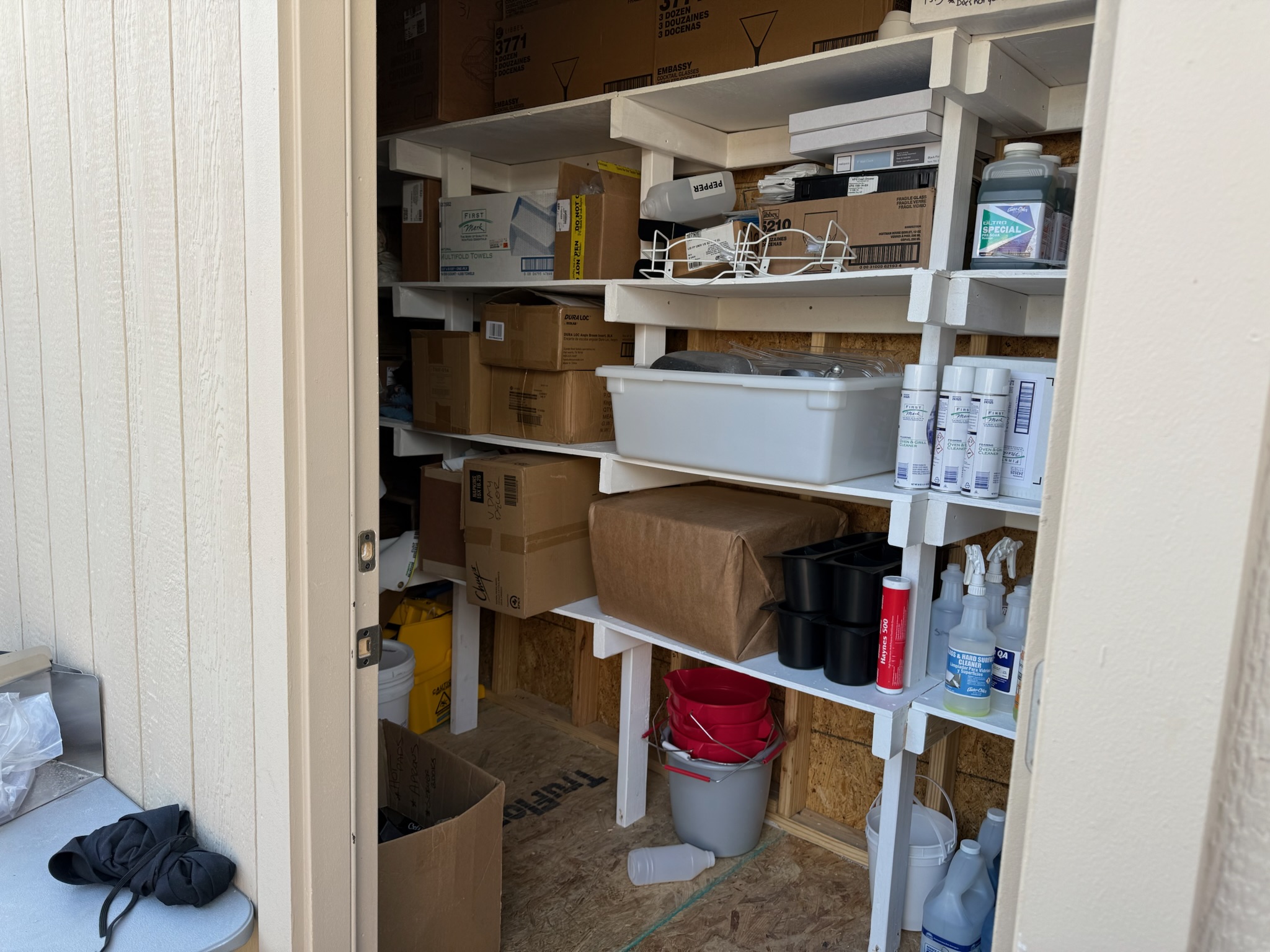 Completed shelving inside the custom Chuy's storage shed
