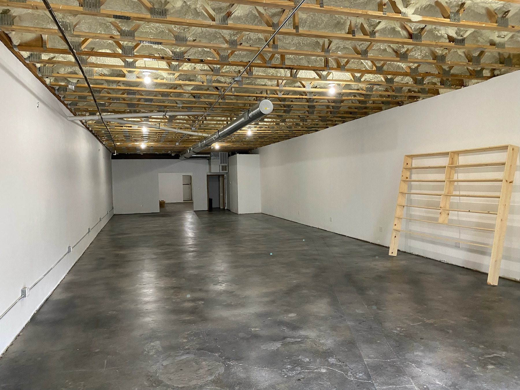 The empty We Luv Video building before construction